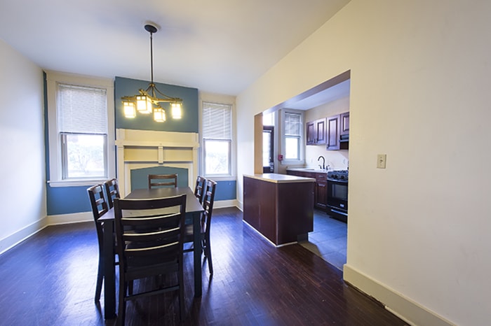 Roselawn Houses Kitchen and Dining Room - dining table with overhead light windows and kitchen space